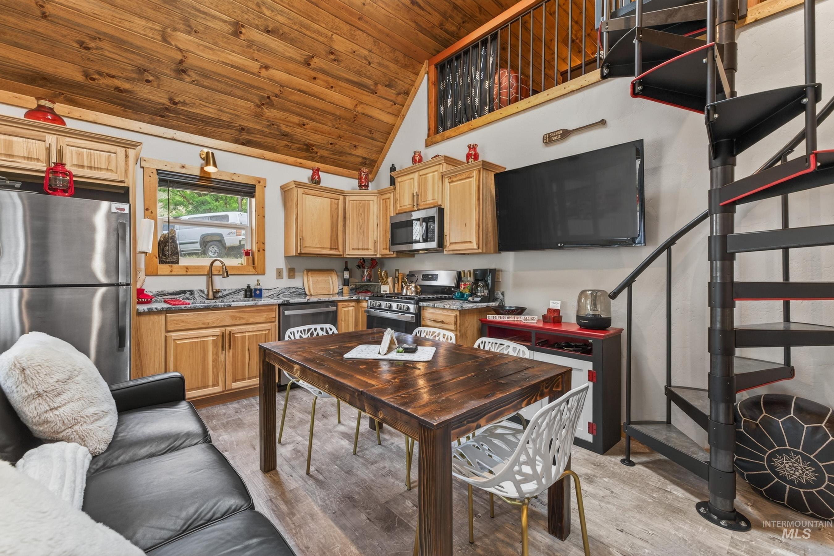 1432 Salmon Drive Riggins, ID 83549 - Photo 8 of 39 Combined kitchen and living space featuring a wood-finish vaulted ceiling