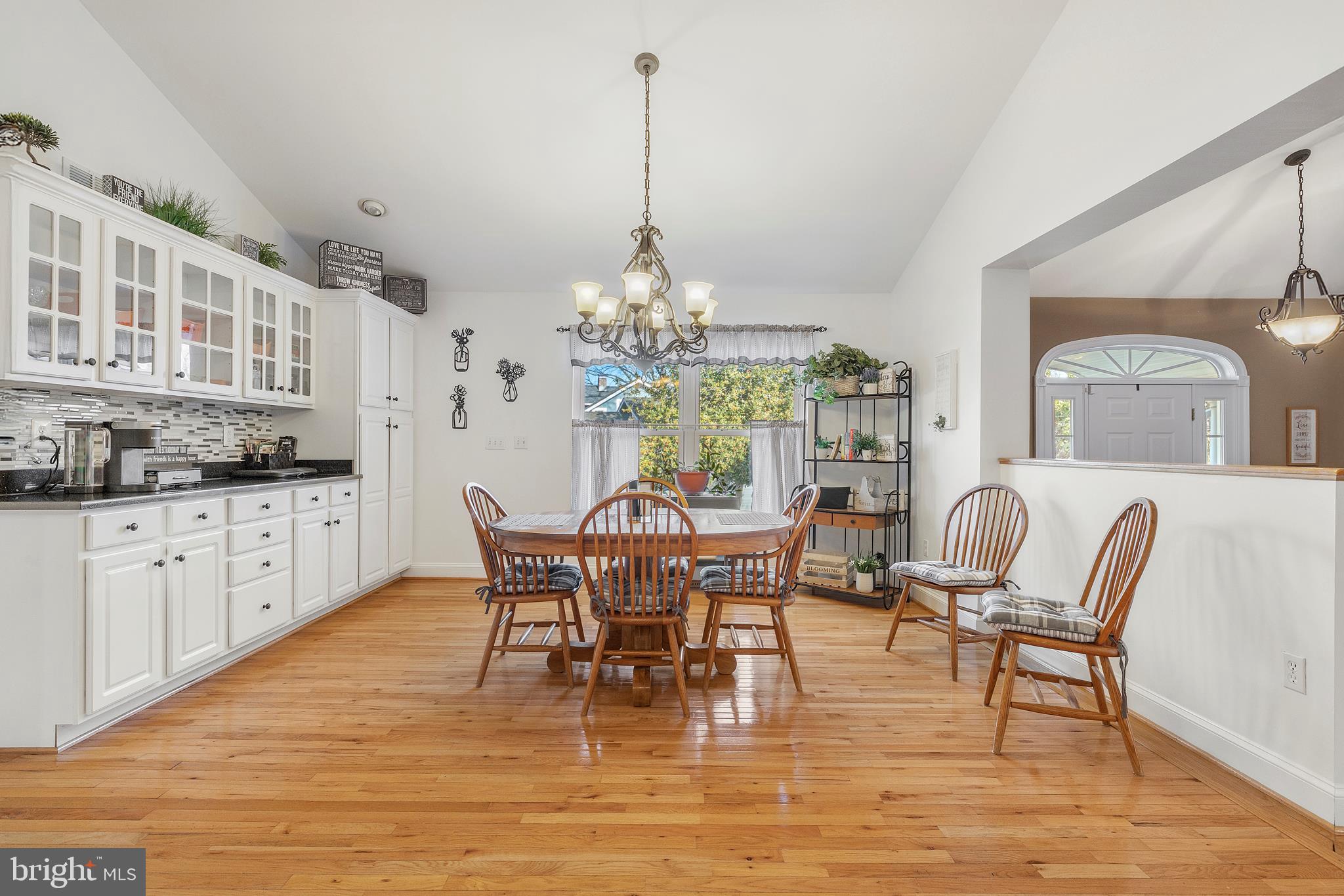 518 North Old Hammonds Ferry Road Linthicum Heights, MD 21090 - Photo 18 of 57 a dining room with furniture a chandelier and wooden floor