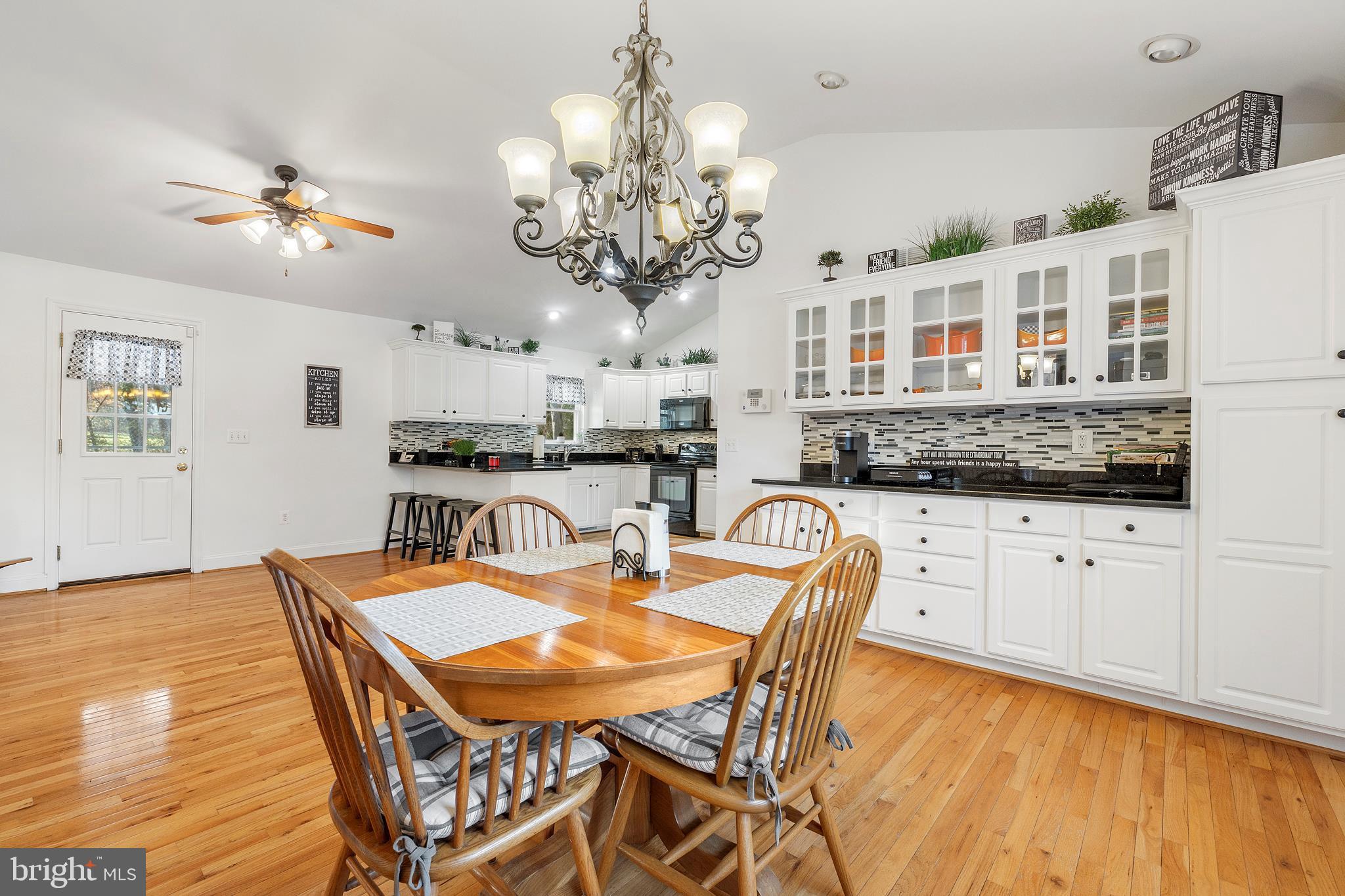 518 North Old Hammonds Ferry Road Linthicum Heights, MD 21090 - Photo 19 of 57 a view of a dining room with furniture and chandelier