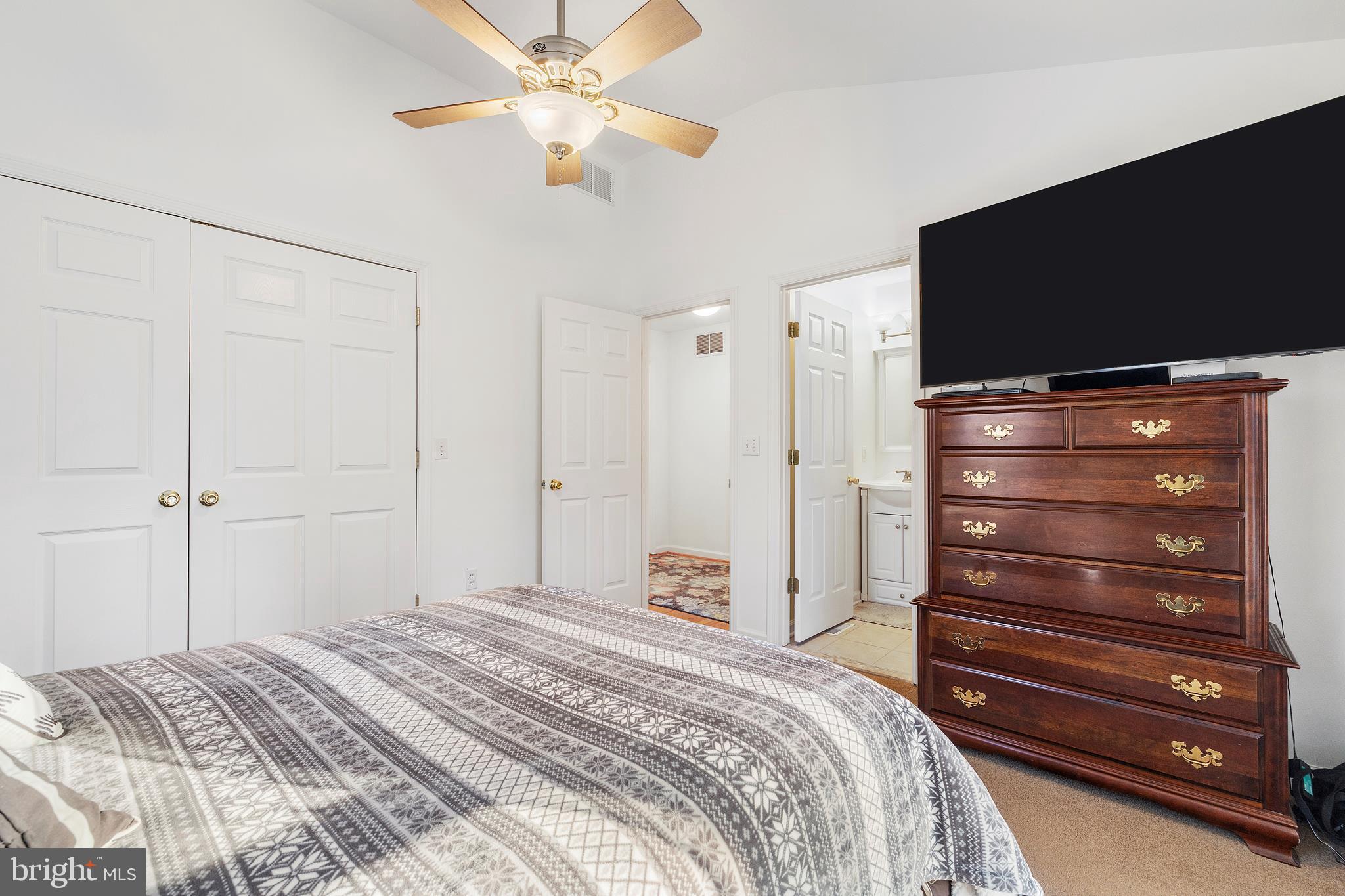 518 North Old Hammonds Ferry Road Linthicum Heights, MD 21090 - Photo 25 of 57 a bedroom with a bed and a flat tv screen on dresser