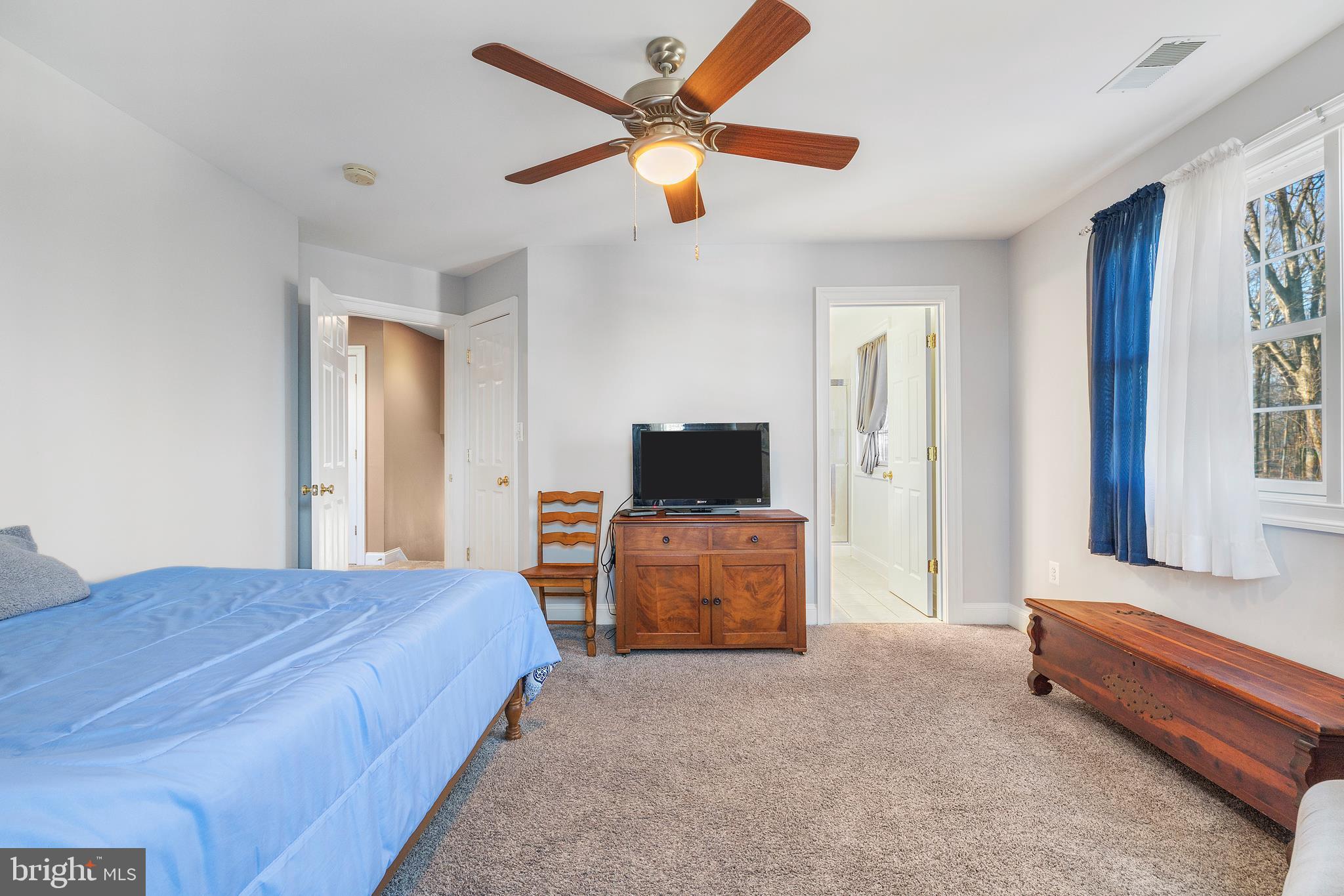 518 North Old Hammonds Ferry Road Linthicum Heights, MD 21090 - Photo 28 of 57 a bedroom with a bed and a television