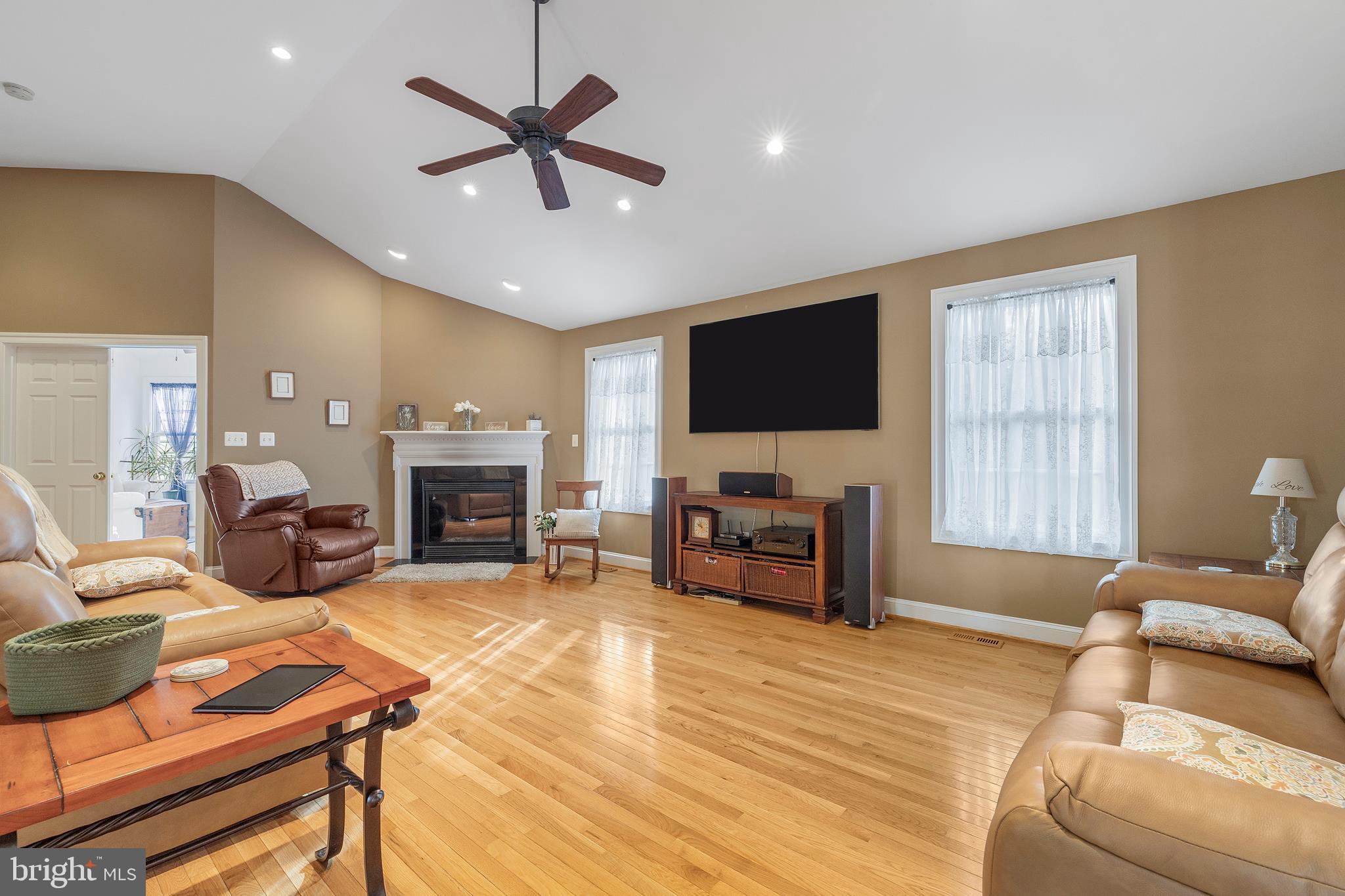 518 North Old Hammonds Ferry Road Linthicum Heights, MD 21090 - Photo 9 of 57 a living room with furniture a fireplace and a flat screen tv