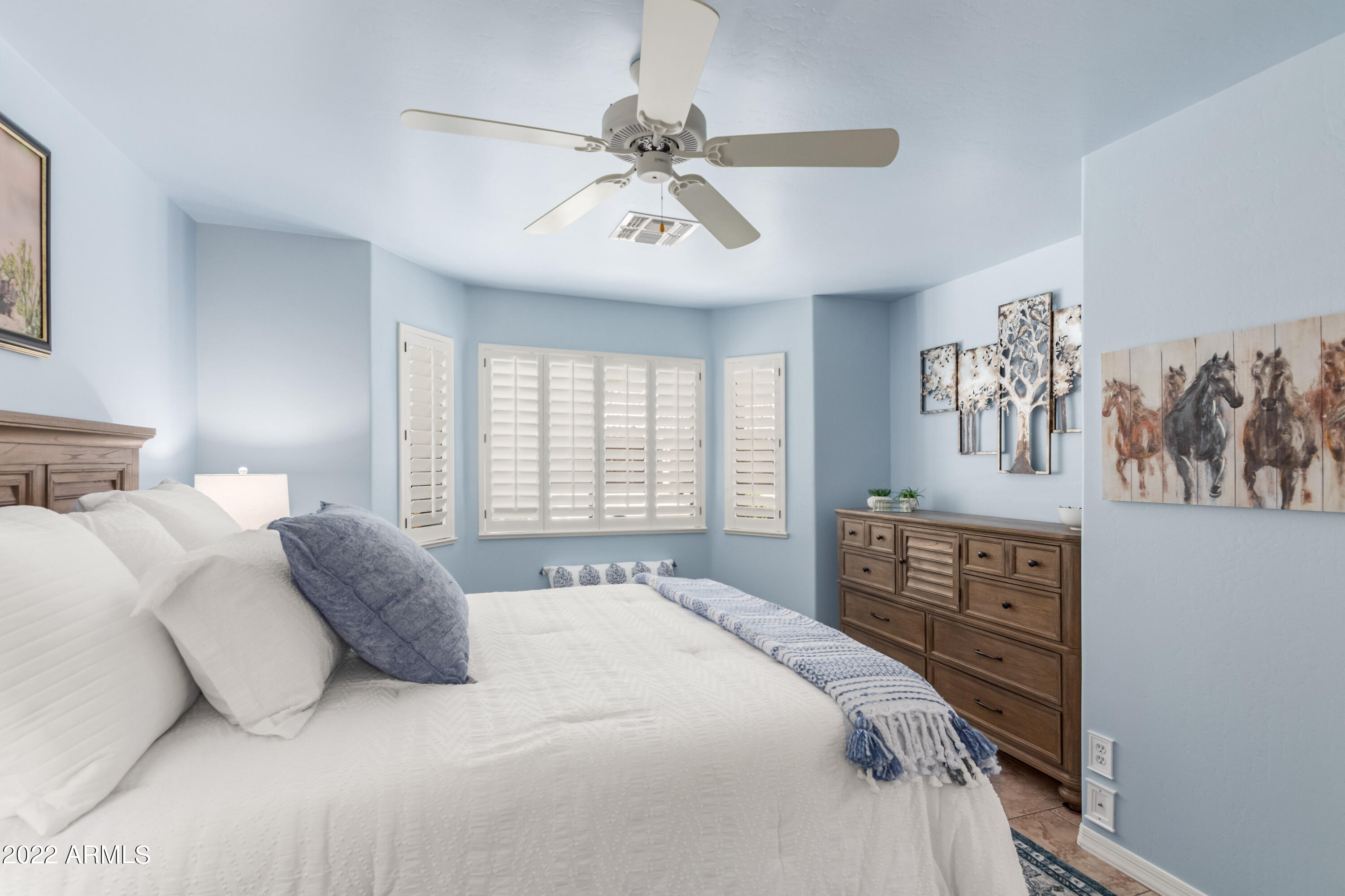5830 East McKellips Road, Unit 76 Mesa, AZ 85215 - Photo 23 of 33 a bedroom with a bed dresser and window
