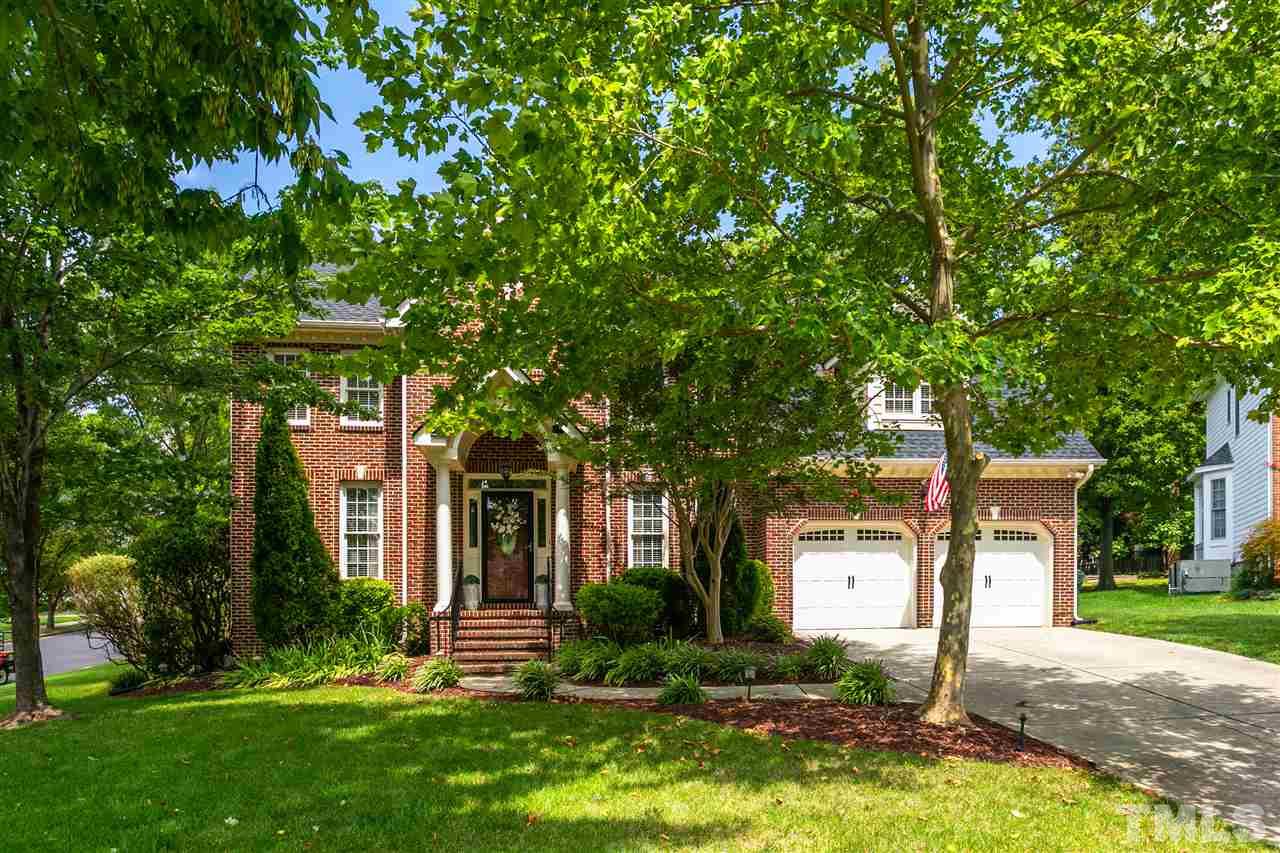 9408 Gabe Court Raleigh, NC 27613 - Photo 2 of 30 a front view of a house with a yard and tree