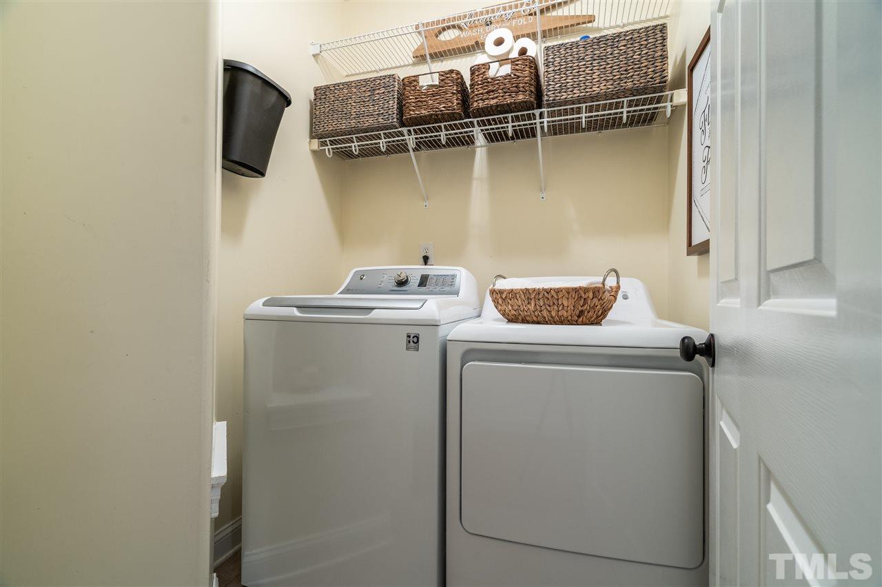 9408 Gabe Court Raleigh, NC 27613 - Photo 17 of 30 a utility room with dryer and washer