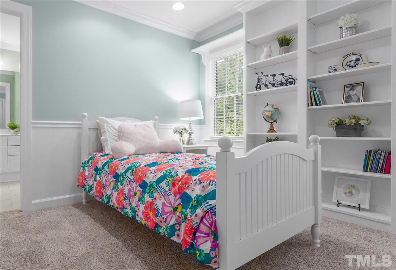 9408 Gabe Court Raleigh, NC 27613 - Photo 22 of 30 a bedroom with a bed and a window