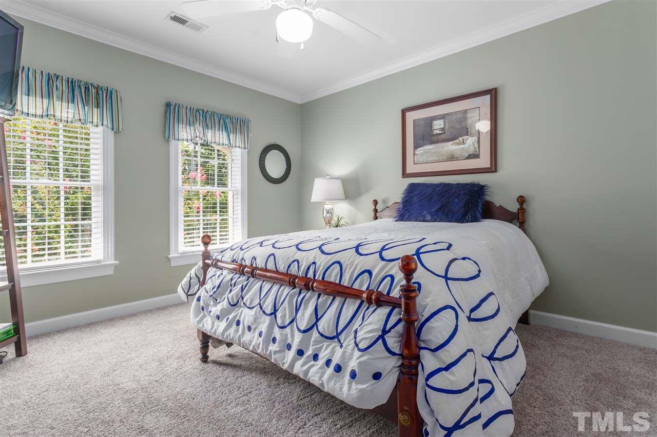 9408 Gabe Court Raleigh, NC 27613 - Photo 23 of 30 a bedroom with a bed and a window