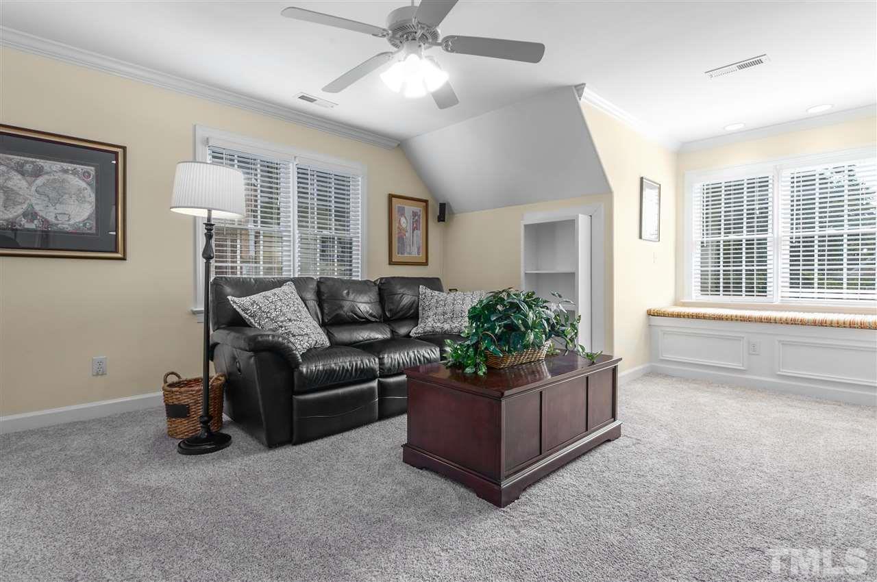 9408 Gabe Court Raleigh, NC 27613 - Photo 25 of 30 a living room with furniture and a potted plant