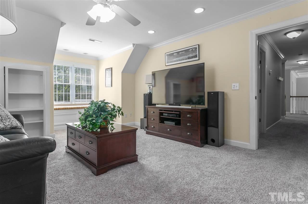 9408 Gabe Court Raleigh, NC 27613 - Photo 26 of 30 a living room with furniture and a flat screen tv