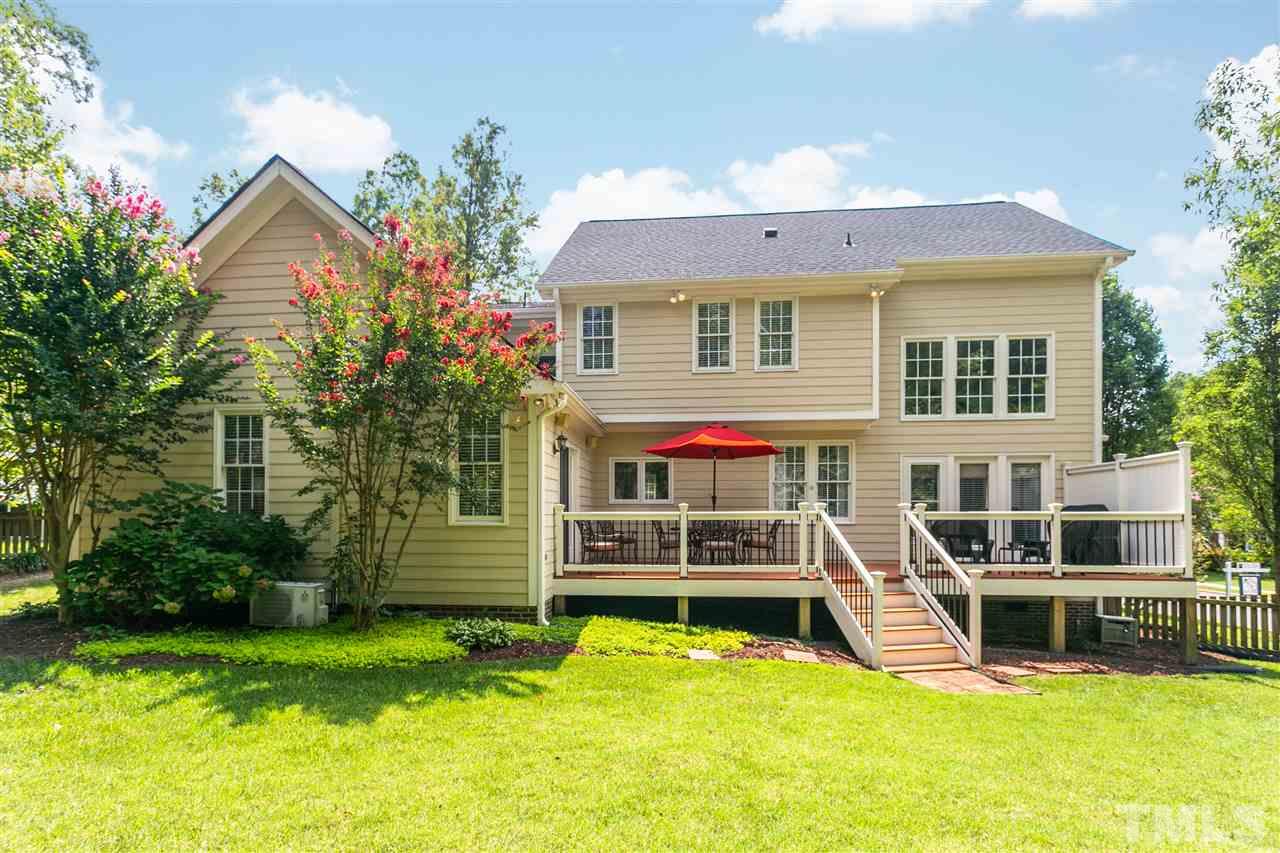 9408 Gabe Court Raleigh, NC 27613 - Photo 29 of 30 a view of a house with a backyard porch and sitting area