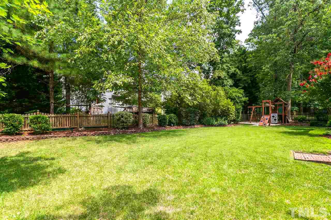 9408 Gabe Court Raleigh, NC 27613 - Photo 30 of 30 a view of a house with a backyard