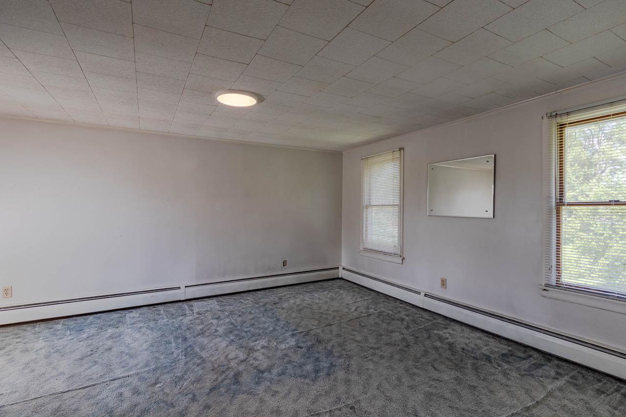 203 Gorton Road Moshannon, PA 16859 - Photo 21 of 39 an empty room with a empty space and windows