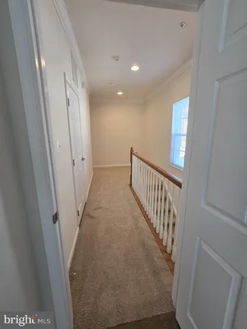 a view of a hallway with staircase