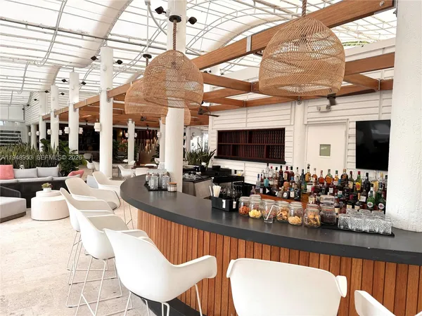 a view of a swimming pool with seating area