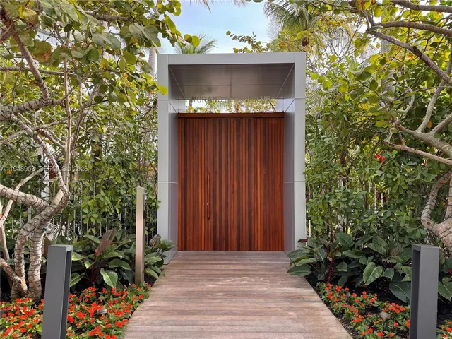 a view of a patio with couches and potted plants