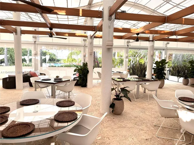 a view of a swimming pool with seating area