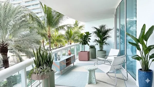 a view of outdoor sitting area with furniture