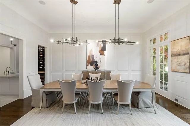 a living room with furniture and large windows