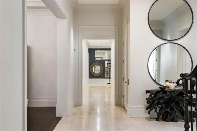 a large white kitchen with a large window