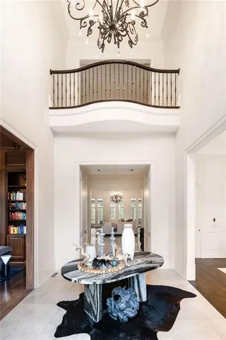 a living room with furniture fireplace and a large window