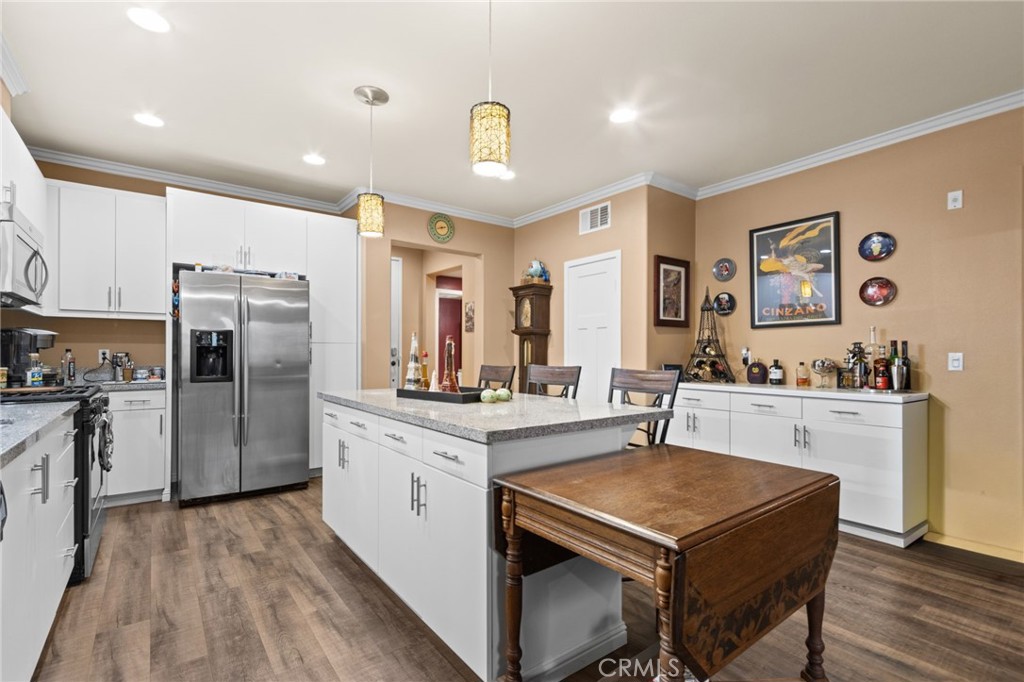 431 South Anaheim Way, Unit 5 Orange, CA 92868 - Photo 12 of 35 a kitchen with stainless steel appliances granite countertop a sink stove and refrigerator