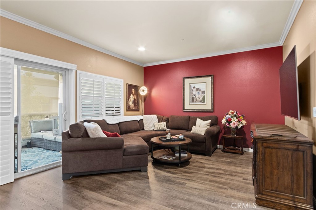 431 South Anaheim Way, Unit 5 Orange, CA 92868 - Photo 16 of 35 a living room with furniture and wooden floor