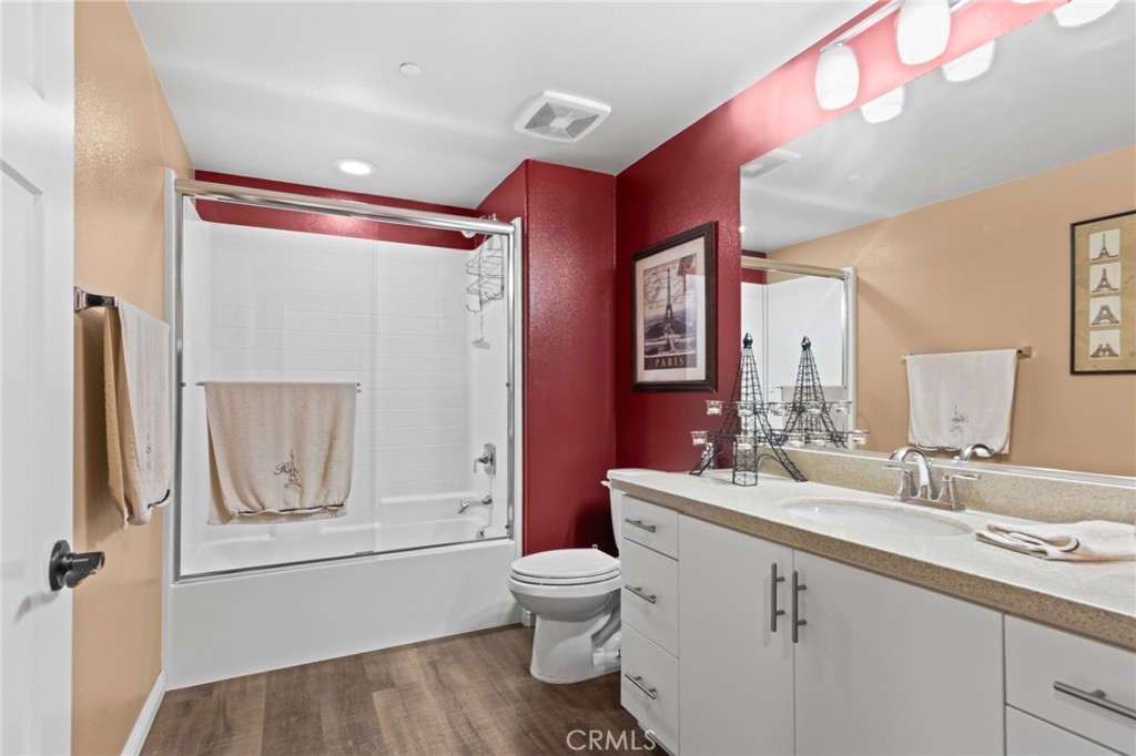 431 South Anaheim Way, Unit 5 Orange, CA 92868 - Photo 18 of 35 a bathroom with a toilet a sink and a mirror