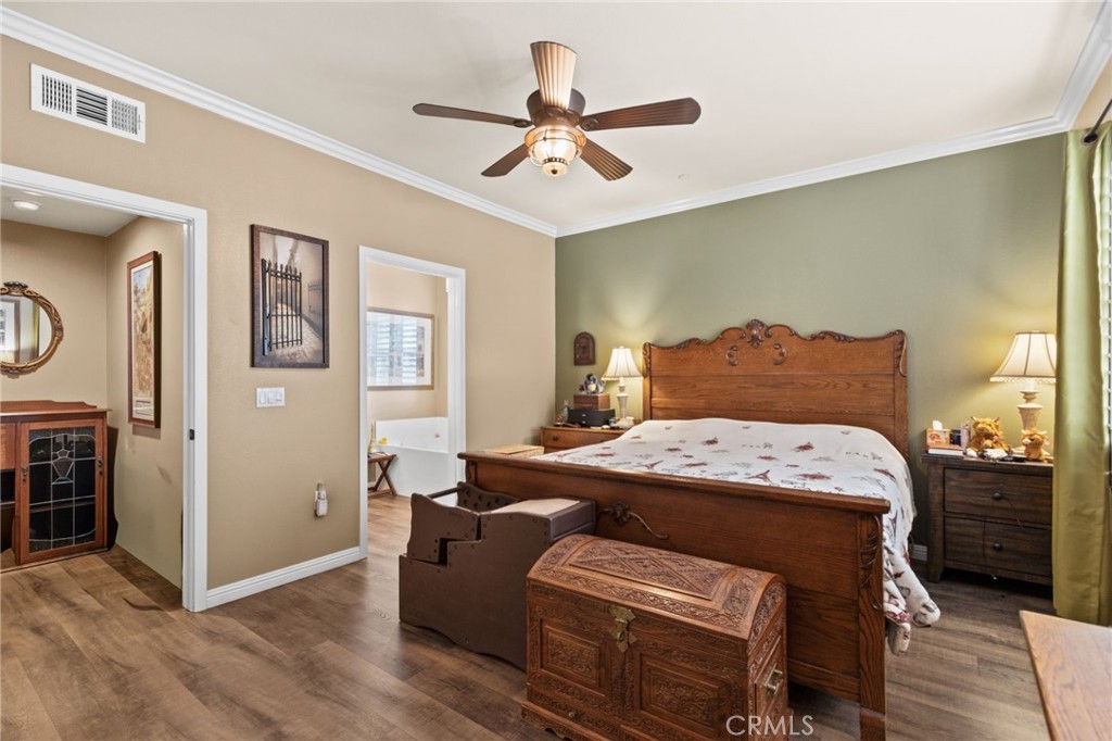 431 South Anaheim Way, Unit 5 Orange, CA 92868 - Photo 22 of 35 a bedroom with a bed and a chandelier
