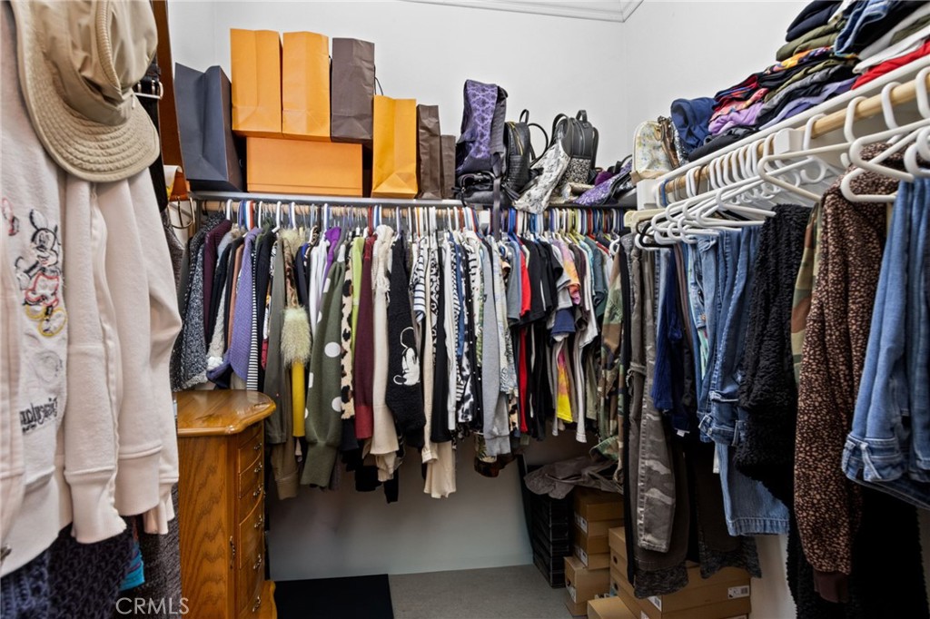 431 South Anaheim Way, Unit 5 Orange, CA 92868 - Photo 24 of 35 a view of walk in closet with clothes and shoes