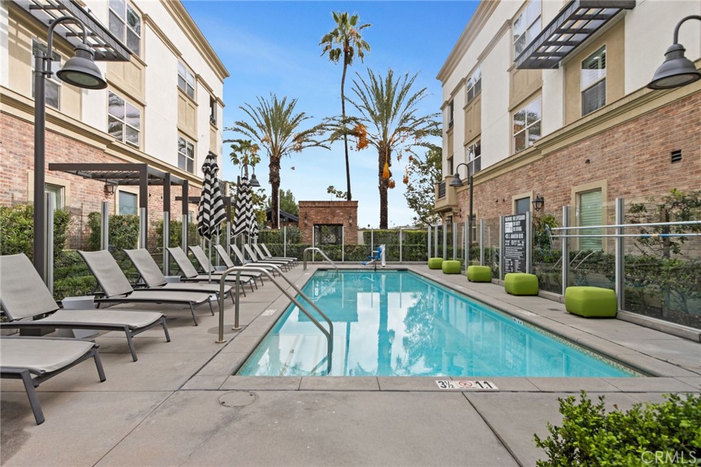 431 South Anaheim Way, Unit 5 Orange, CA 92868 - Photo 32 of 35 a view of a swimming pool with chairs