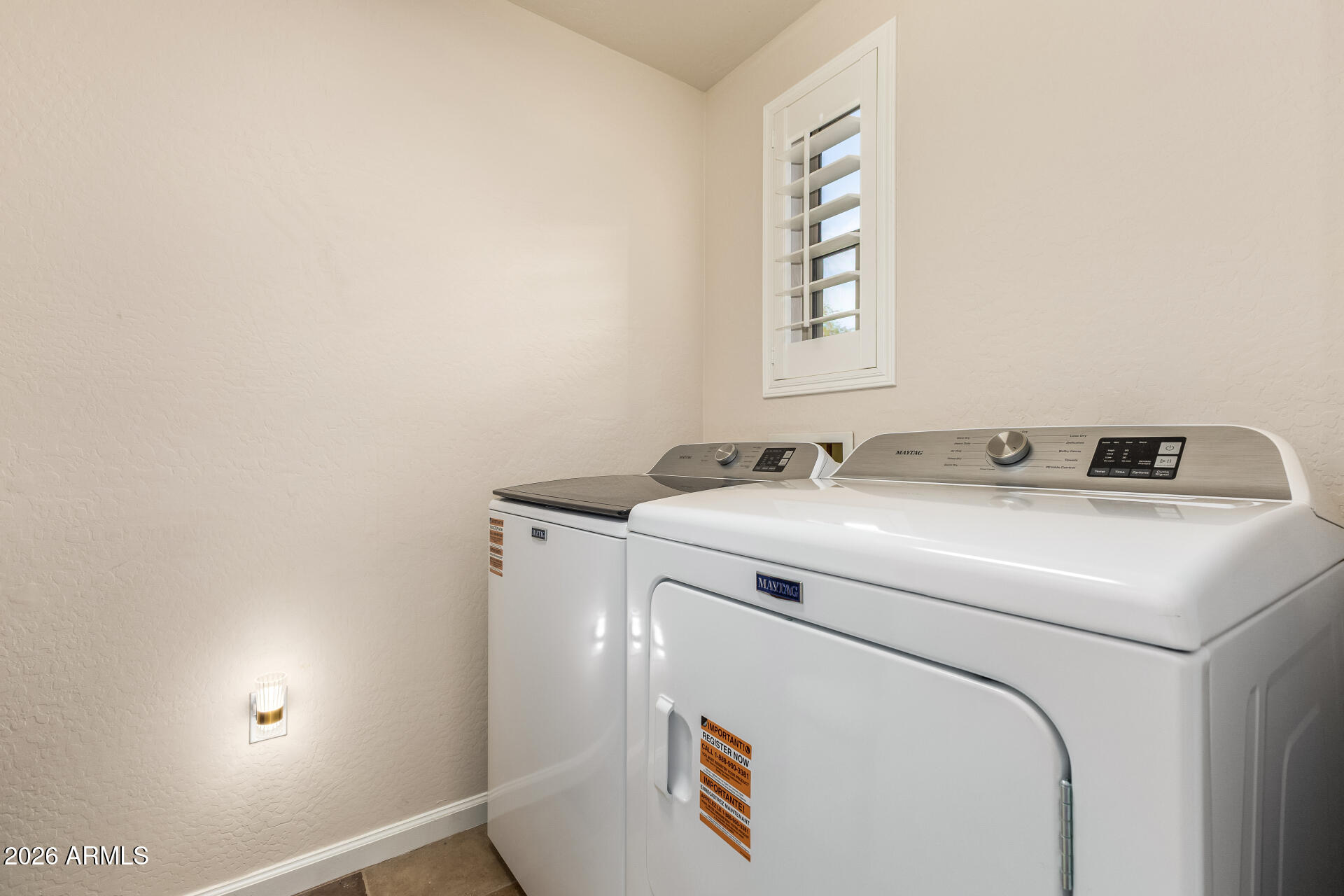 3935 East Rough Rider Road, Unit 1197 Phoenix, AZ 85050 - Photo 8 of 51 a utility room with dryer and washer