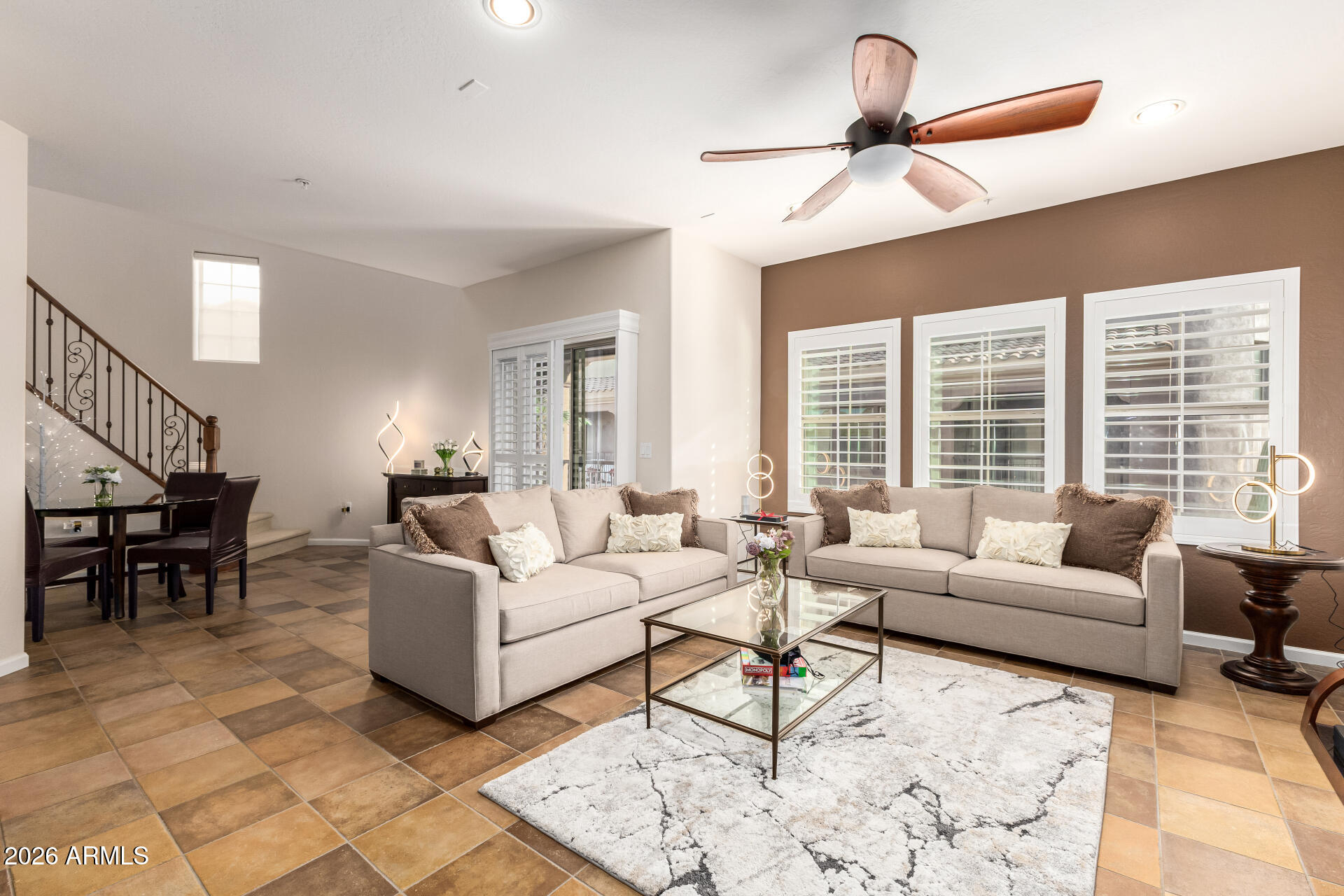 3935 East Rough Rider Road, Unit 1197 Phoenix, AZ 85050 - Photo 13 of 51 a living room with furniture and a large window
