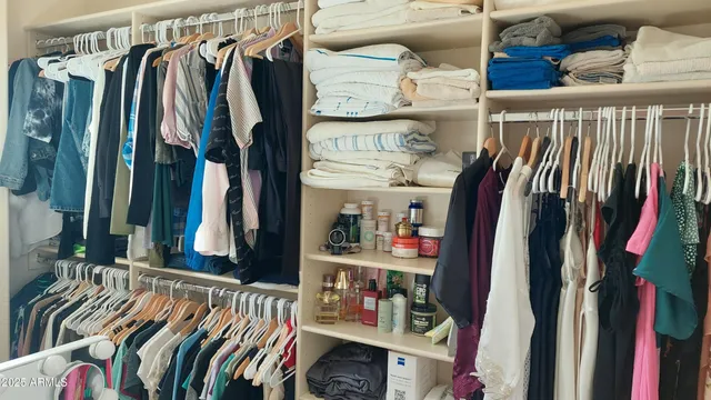 a spacious bathroom with a granite countertop sink a toilet a mirror and bathtub