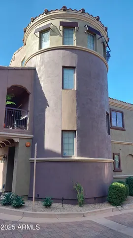 a picture of a room with a bench and a white wall