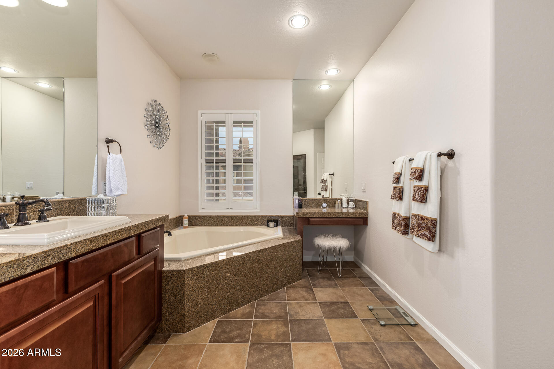 3935 East Rough Rider Road, Unit 1197 Phoenix, AZ 85050 - Photo 31 of 51 a large bathroom with a sink and a bathtub