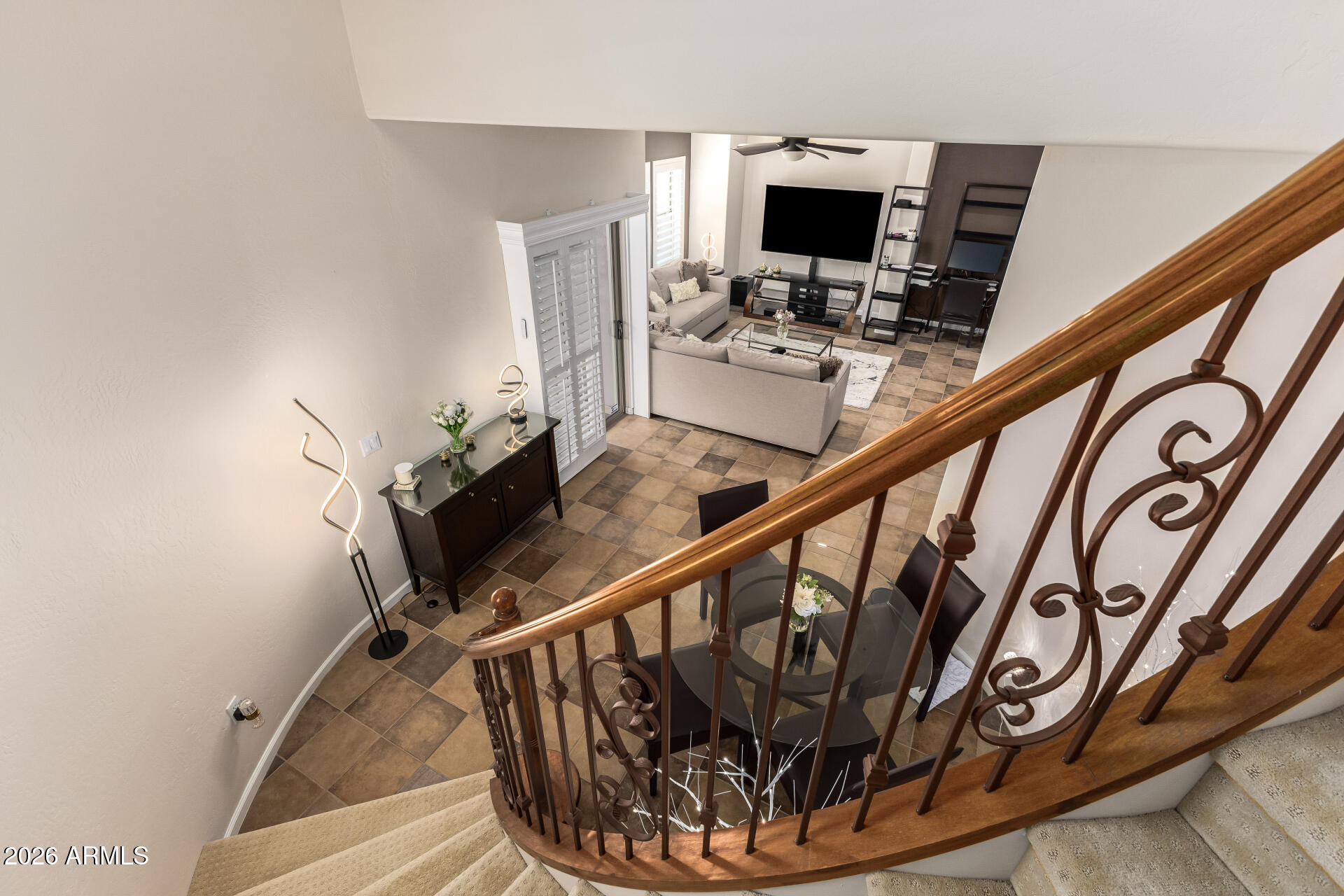 3935 East Rough Rider Road, Unit 1197 Phoenix, AZ 85050 - Photo 34 of 51 a view of a hallway with couches and dining table with wooden floor
