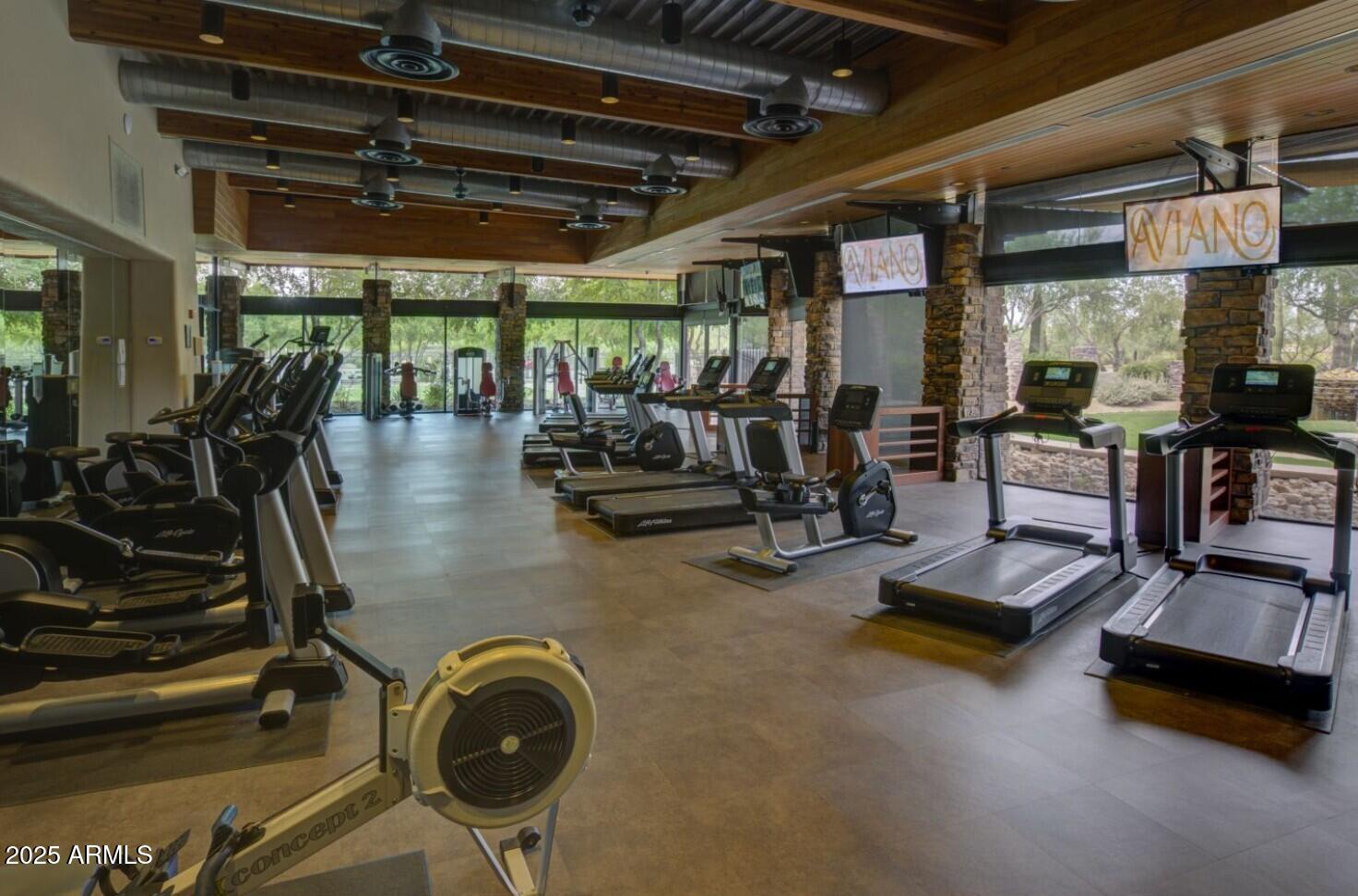 3935 East Rough Rider Road, Unit 1197 Phoenix, AZ 85050 - Photo 39 of 51 a view of a room with gym equipment