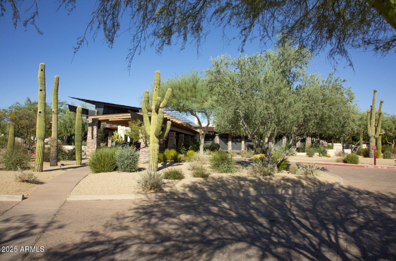 3935 East Rough Rider Road, Unit 1197 Phoenix, AZ 85050 - Photo 40 of 51 a view of a house with a yard