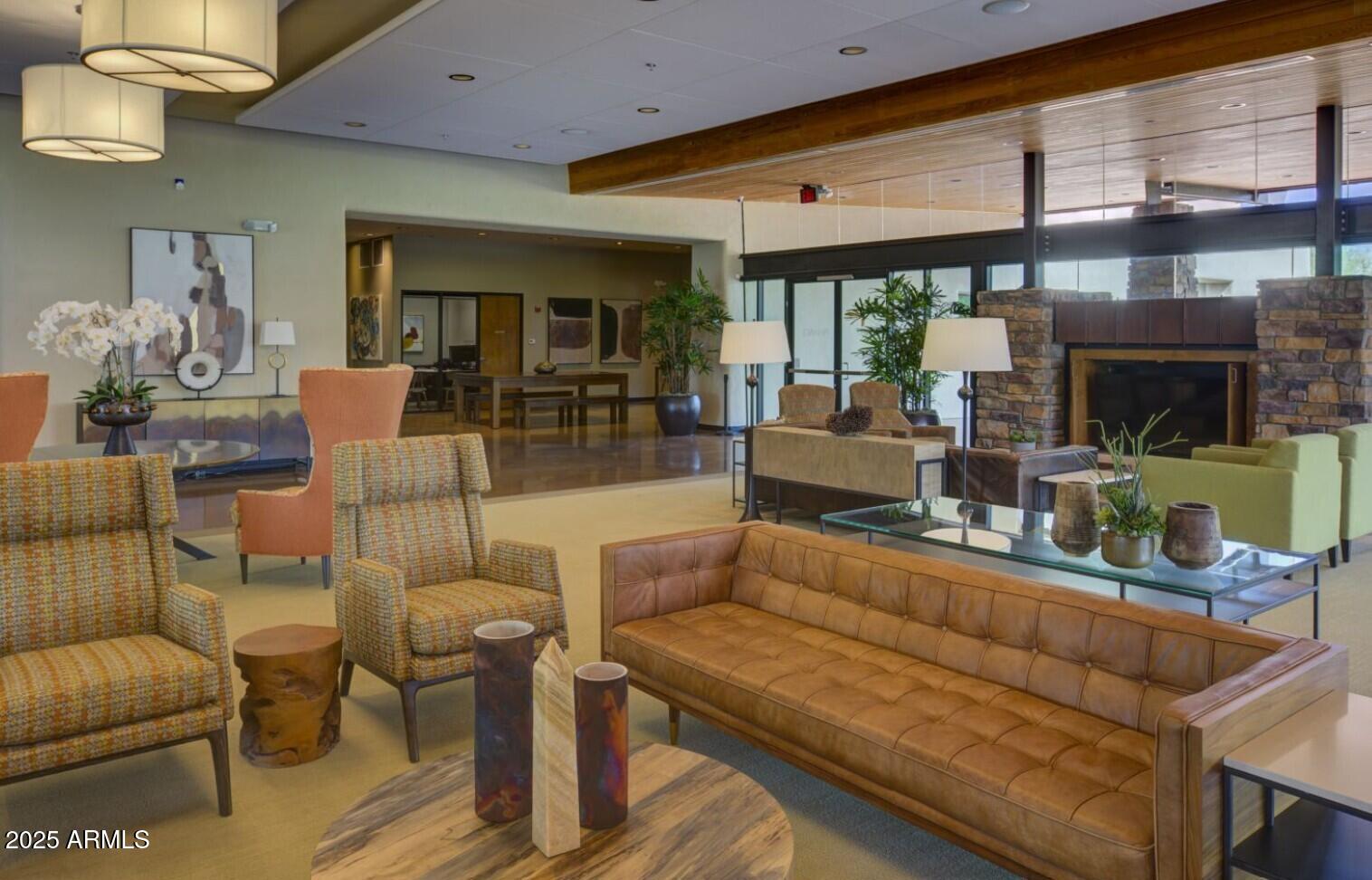 3935 East Rough Rider Road, Unit 1197 Phoenix, AZ 85050 - Photo 41 of 51 a living room with furniture and a large window