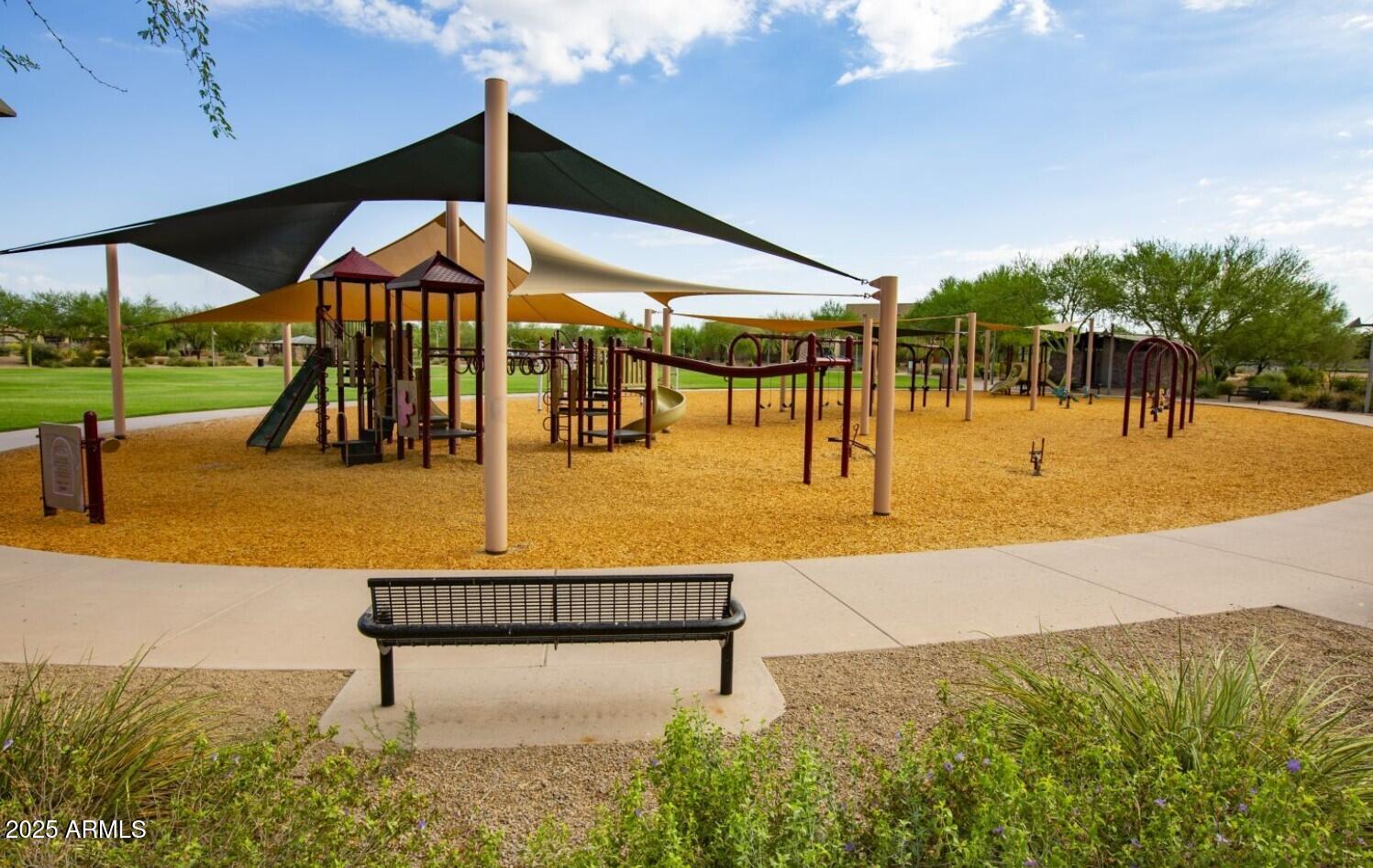 3935 East Rough Rider Road, Unit 1197 Phoenix, AZ 85050 - Photo 42 of 51 a view of a swimming pool with a patio