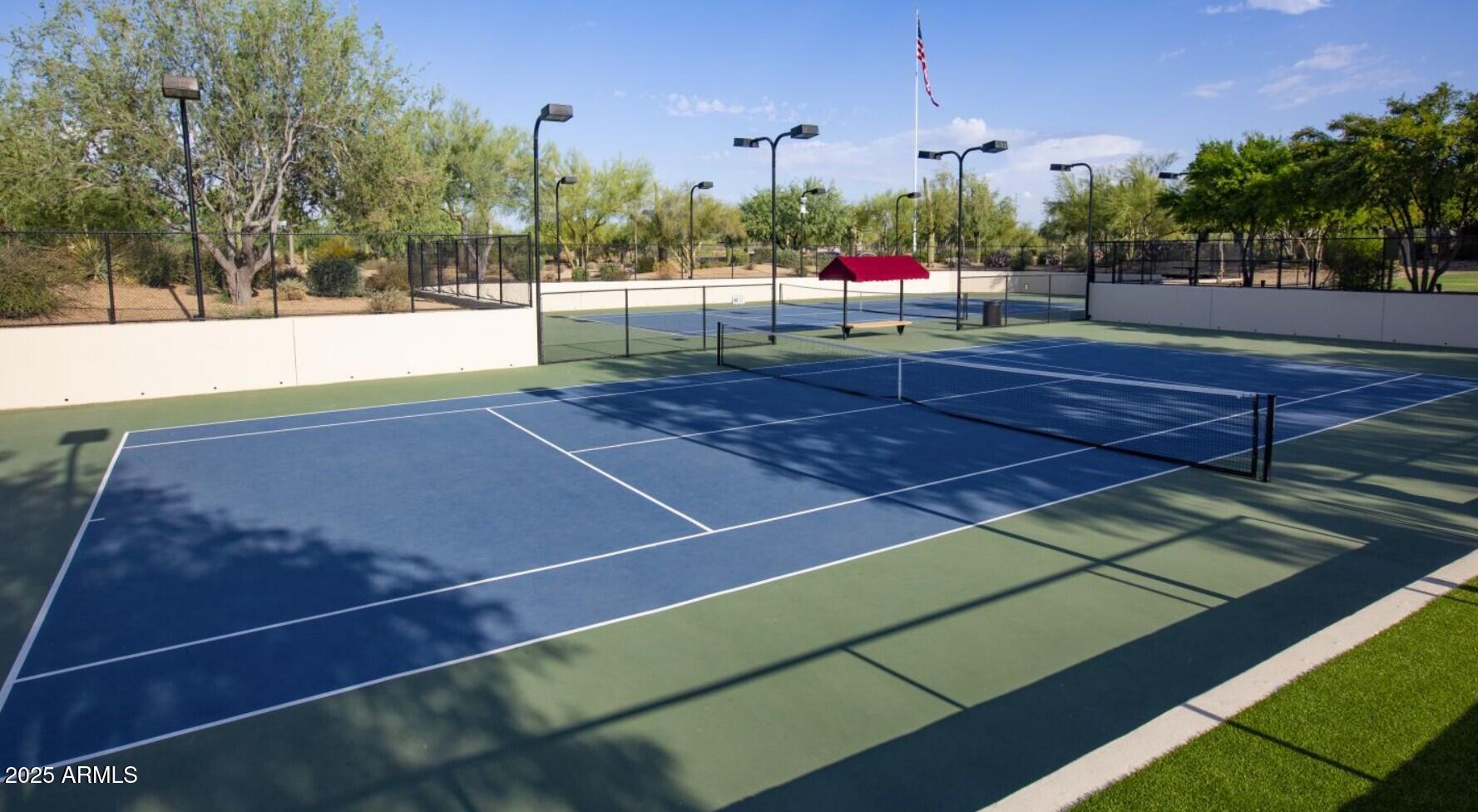 3935 East Rough Rider Road, Unit 1197 Phoenix, AZ 85050 - Photo 44 of 51 a view of a tennis court