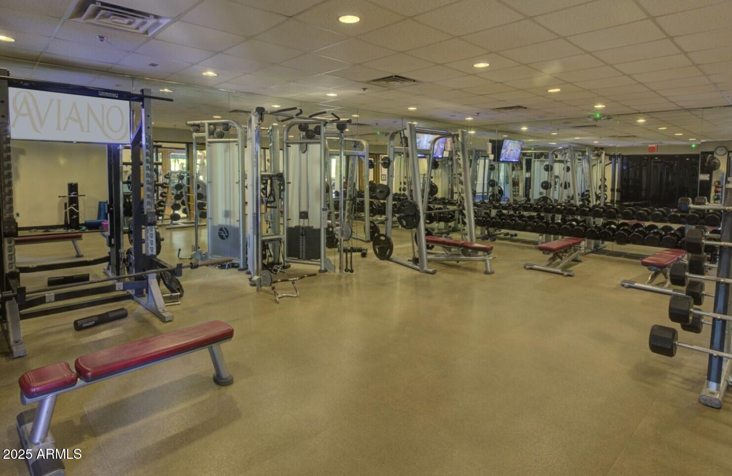 3935 East Rough Rider Road, Unit 1197 Phoenix, AZ 85050 - Photo 45 of 51 a view of a room with gym equipment