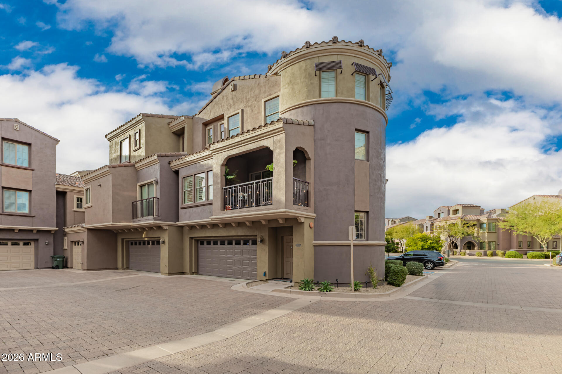 3935 East Rough Rider Road, Unit 1197 Phoenix, AZ 85050 - Photo 3 of 51 a front view of a building with a street