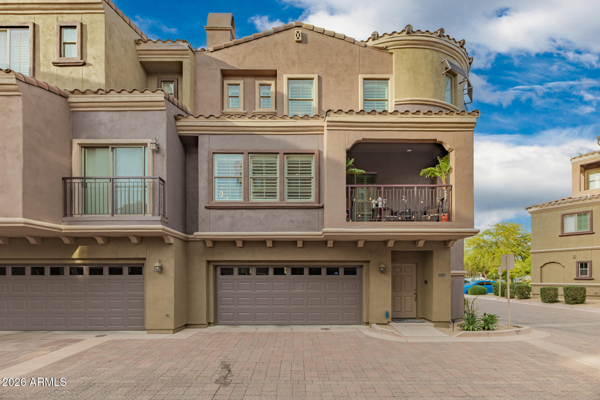 3935 East Rough Rider Road, Unit 1197 Phoenix, AZ 85050 - Photo 4 of 51 a front view of a house with a garden