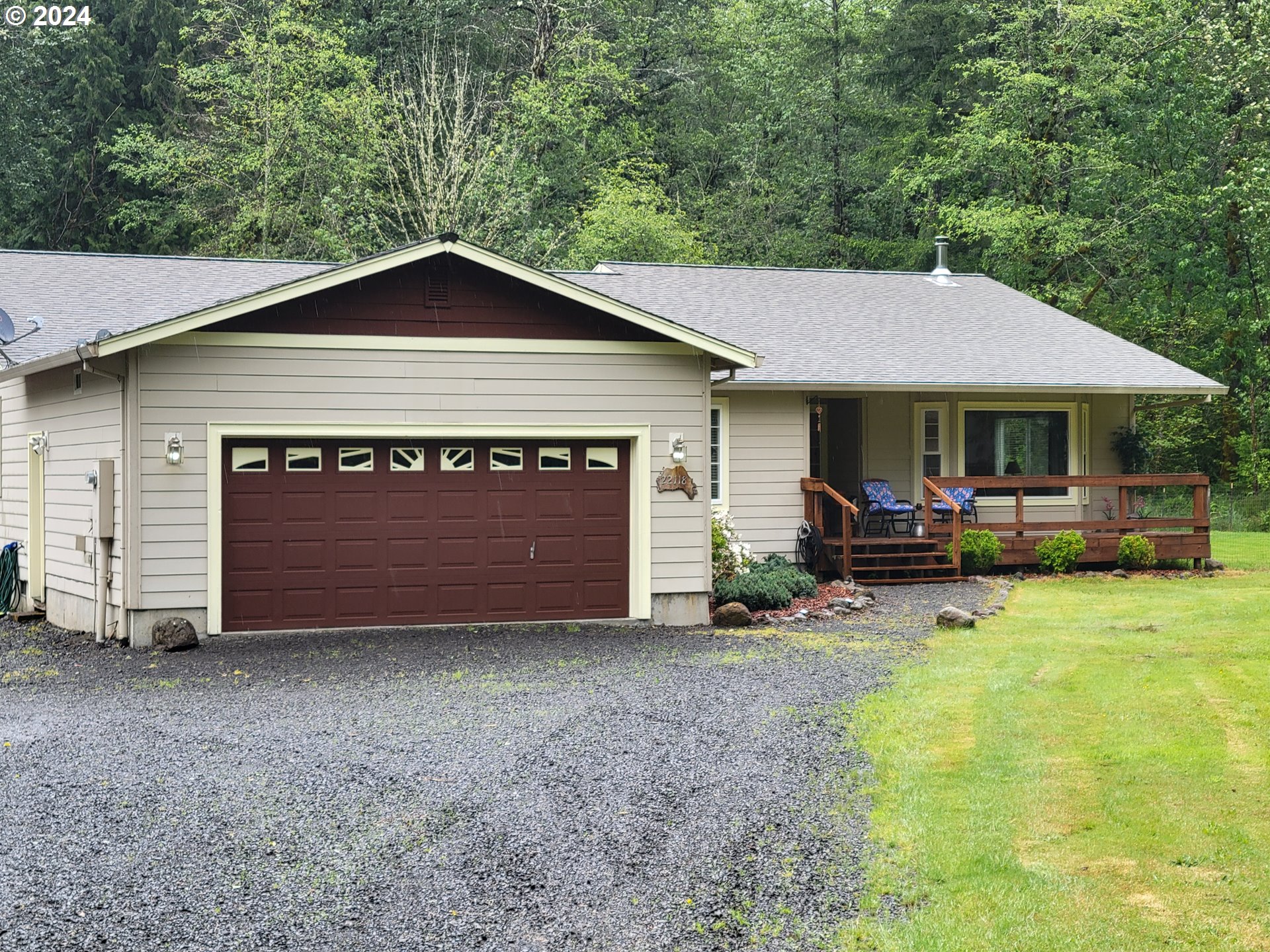 22118 East Yakima Lane Rhododendron, OR 97049 - Photo 1 of 31 a view of a house with backyard and porch