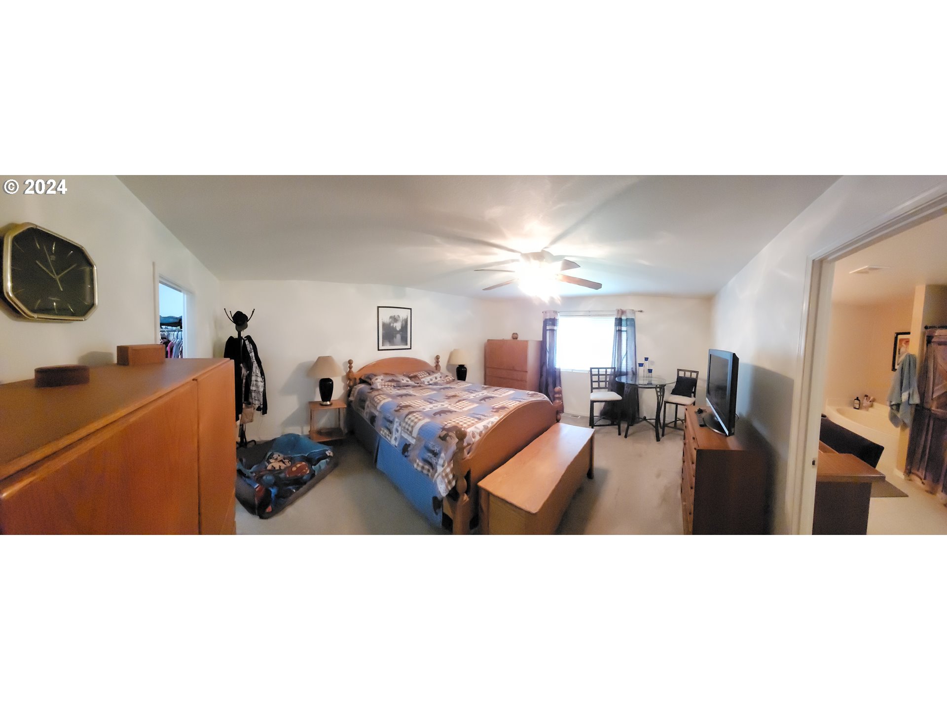 22118 East Yakima Lane Rhododendron, OR 97049 - Photo 12 of 31 a living room with furniture a flat screen tv