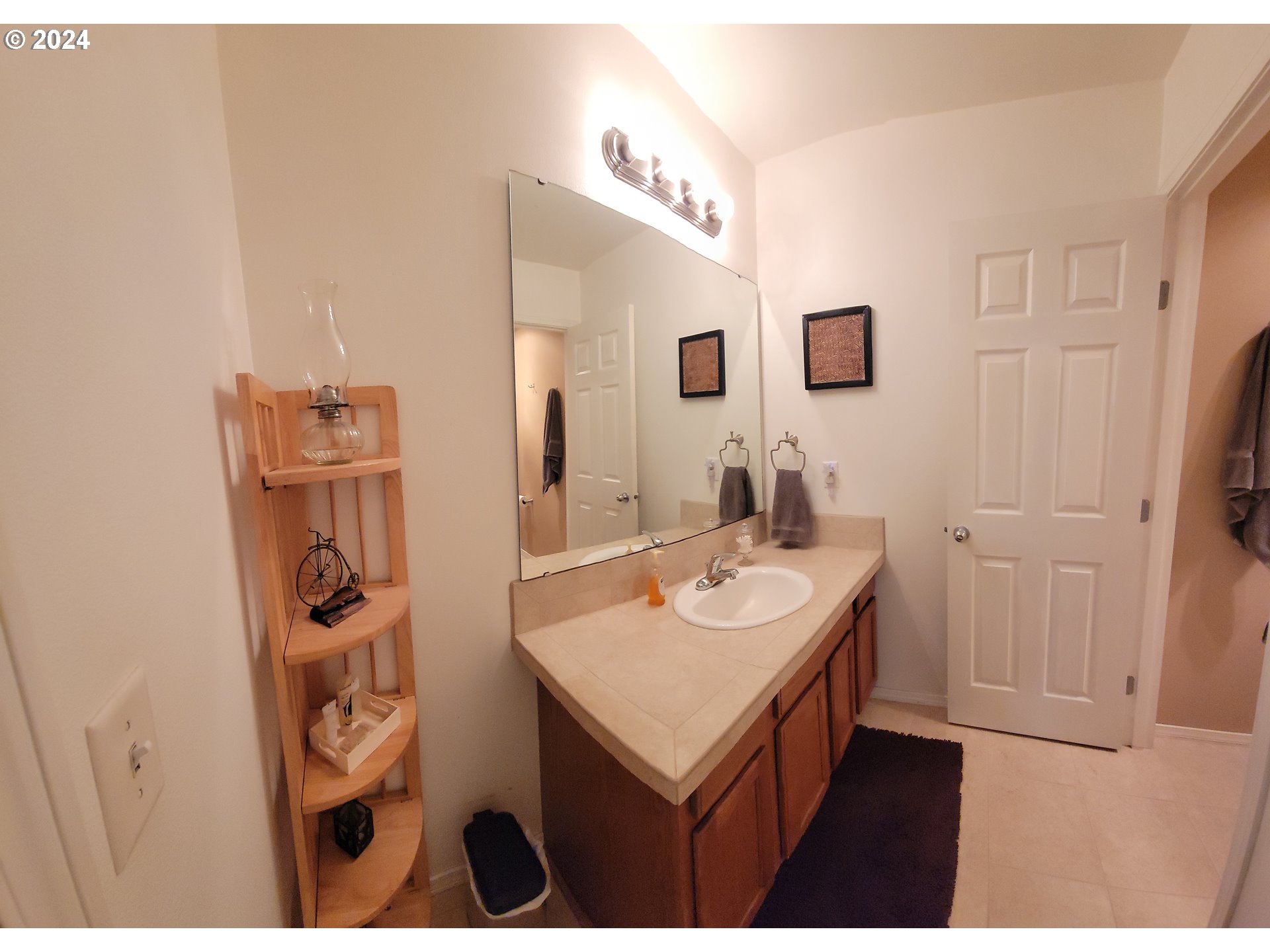 22118 East Yakima Lane Rhododendron, OR 97049 - Photo 9 of 31 a bathroom with a sink and a mirror