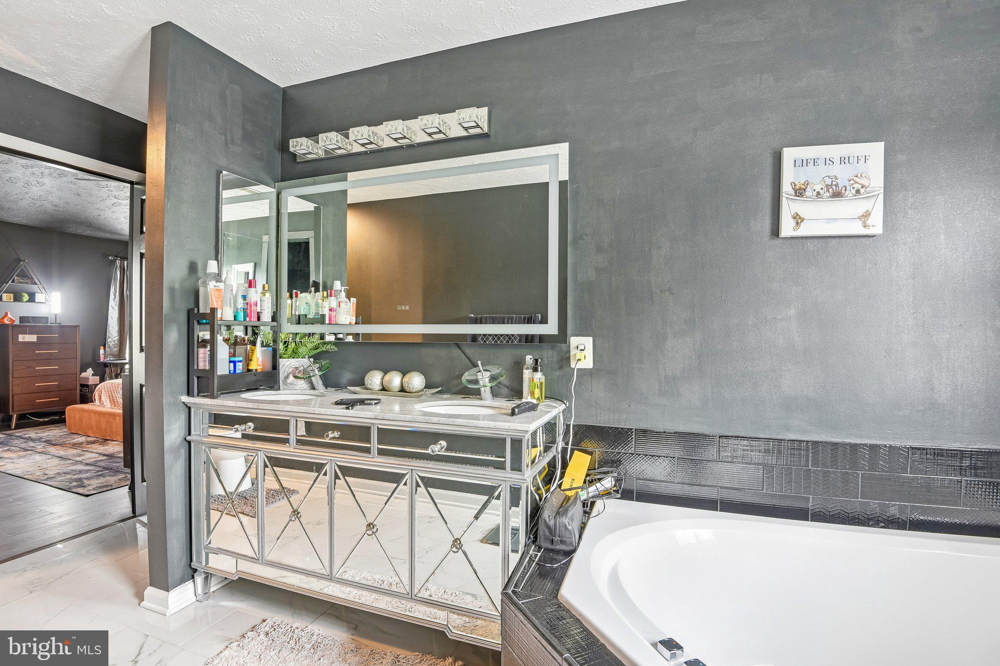 306 Watertons Way Joppa, MD 21085 - Photo 28 of 50 a bath tub sitting next to a bathroom sink
