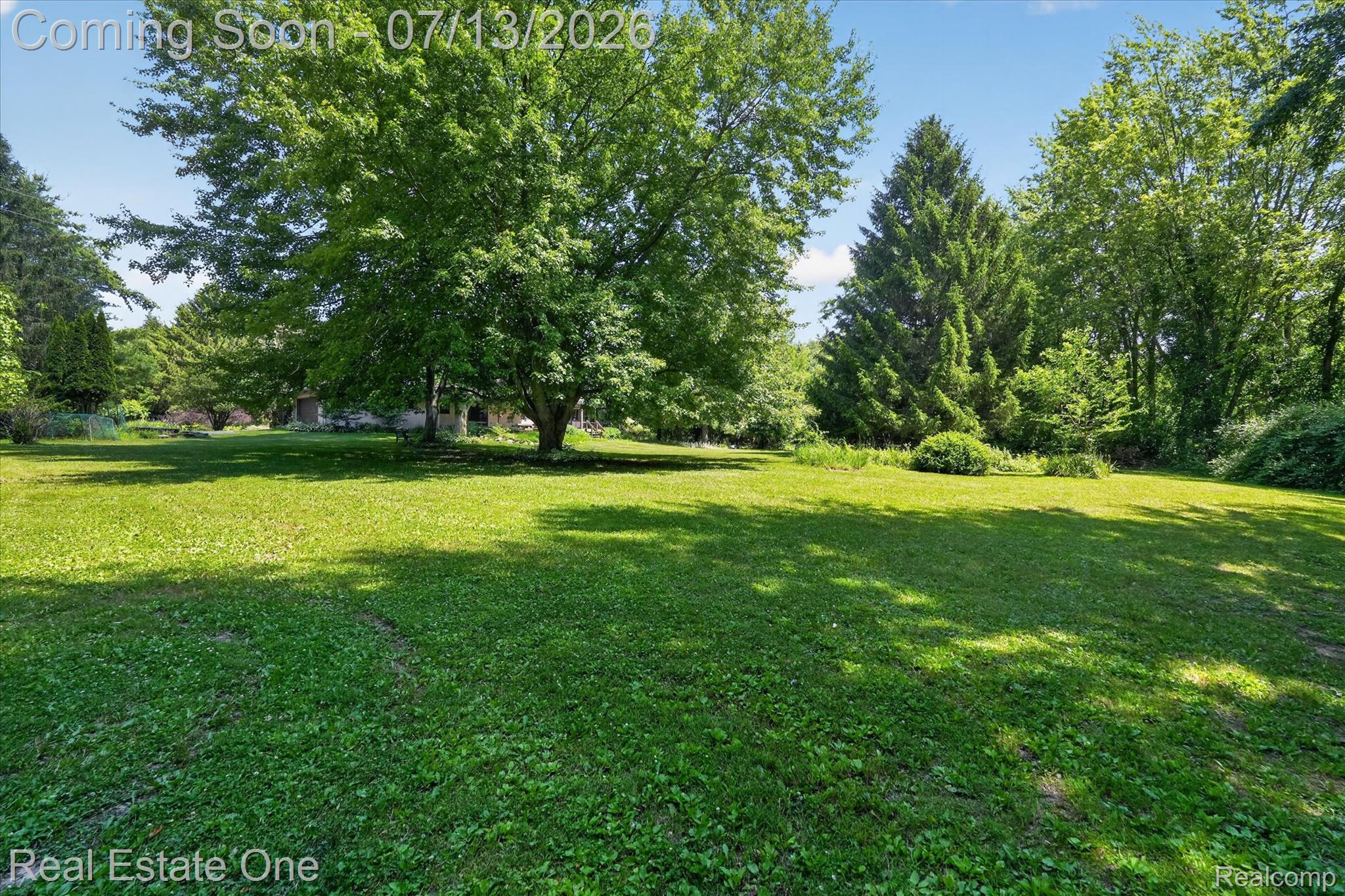 6039 Fish Lake Road Holly, MI 48442 - Photo 50 of 70 Expansive lawn area featuring mature trees and established perimeter landscaping