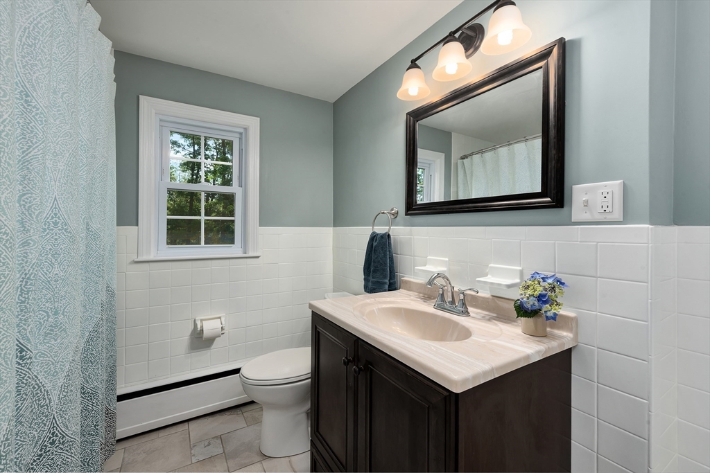 41 Woodcrest Road Boxford, MA 01921 - Photo 17 of 31 a bathroom with a toilet sink and mirror